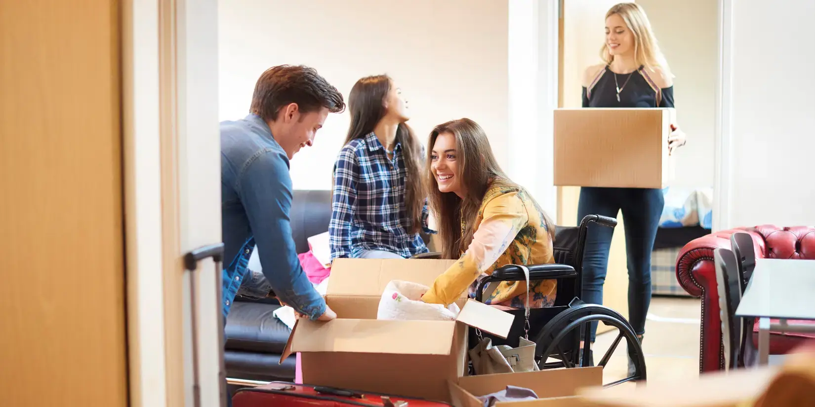 Students unpacking boxes in accommodation